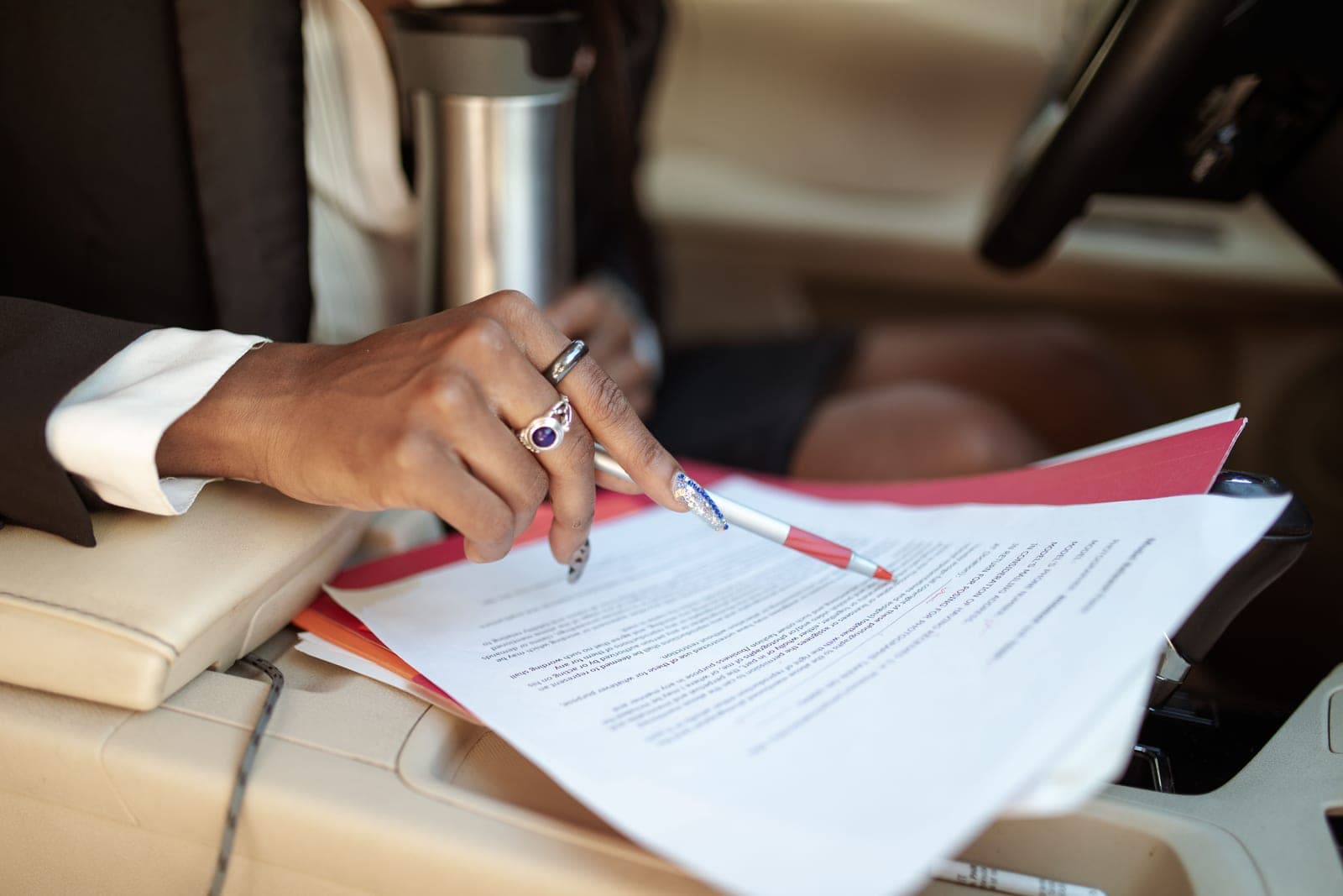 Vehicle paperwork being checked inside a car