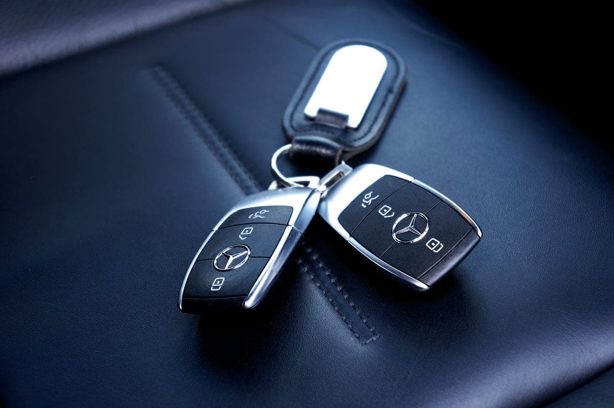 Car keys resting on a leather seat