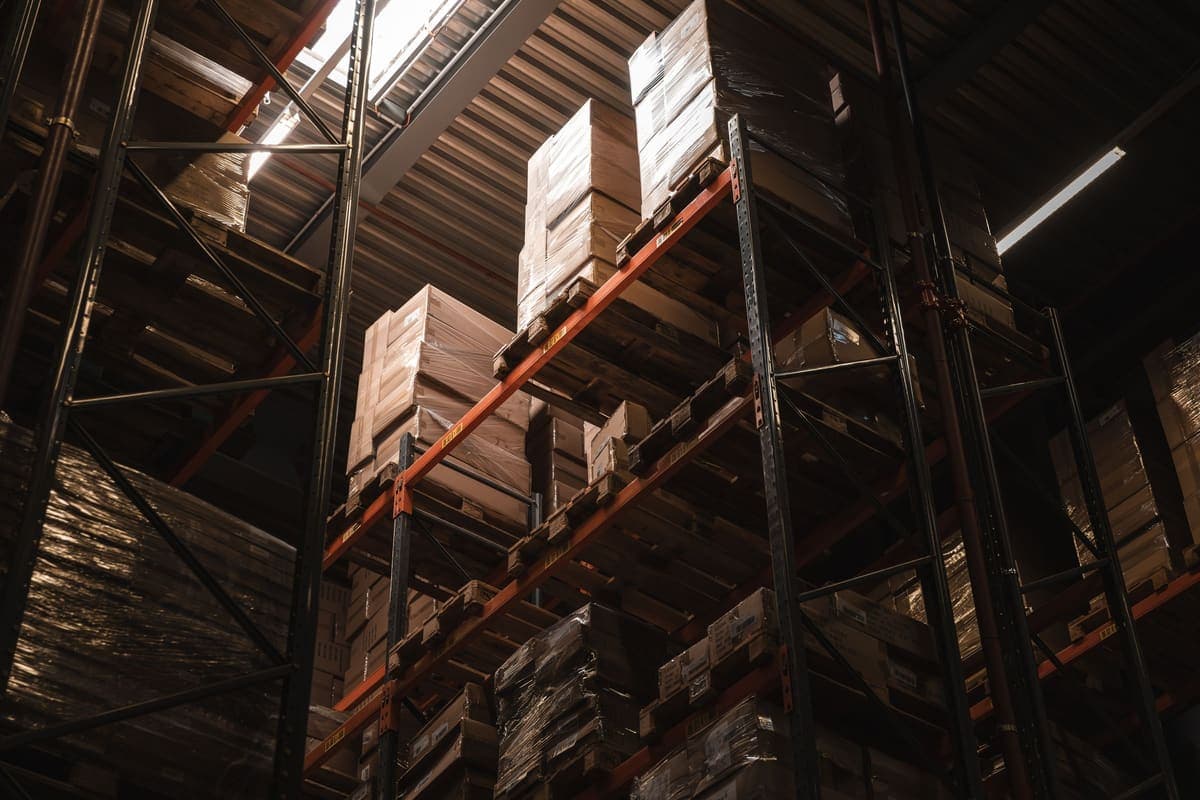 Palletised boxes stacked on high warehouse racking