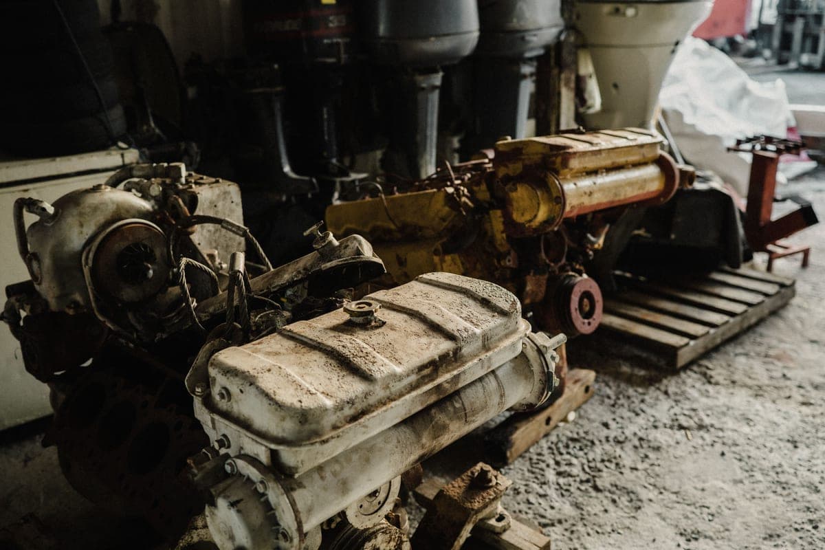 Used car engines and components stored in an industrial workshop